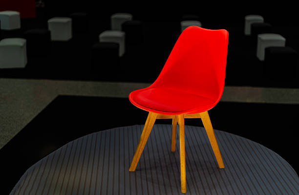A digitally generated image featuring one distinct chair among a group of identical chairs, symbolizing leadership, uniqueness, and the value of diverse roles in teamwork. This minimal yet powerful design represents individuality within a team, making it ideal for business strategy, leadership development, and organizational culture visuals.