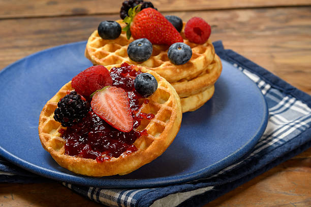 istock Golden Waffles Topped with Berry Jam and Fresh Fruit 2247465695