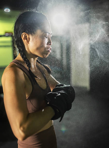 istock female boxer getting motivated before the fight. portrait 2247466004