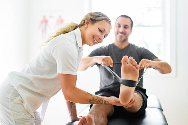 A Modern rehabilitation physiotherapy woman with man client