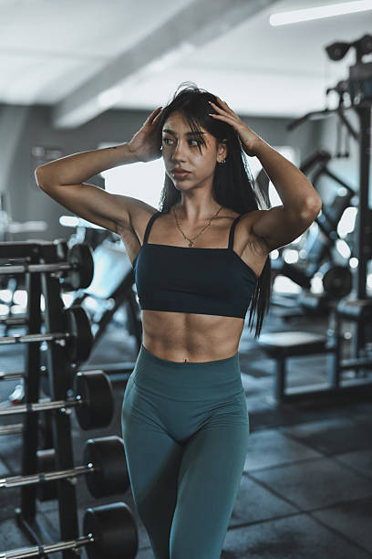 istock Confident Female Athlete Poses in Modern Gym During Intense Workout Session 2247469582