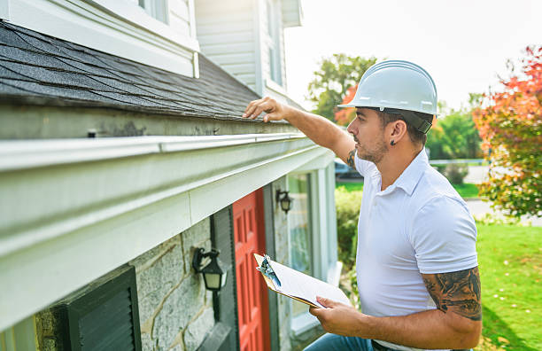 istock Man with a white hard hat holding a clipboard, inspect house roof 2247469929