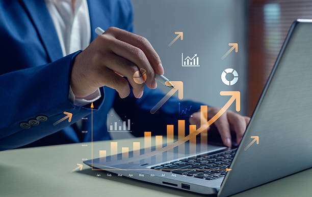 istock Business growth and financial success concept with businessman analyzing data and pointing at digital chart with upward arrows. Suitable for finance, strategy, investment, and innovation themes. 2247470841