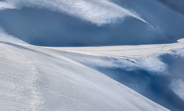 istock freshly snow and immaculate  with delicate shadows on ski slope in snowy  mountain in alpine ski resort 2247471674