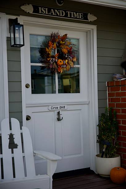 istock Vintage cottage with autumn wreath 2247471912