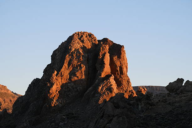 istock Rugged volcanic landscape and distant village 2247471939