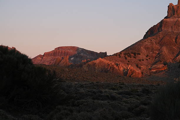 Rugged volcanic landscape and distant village