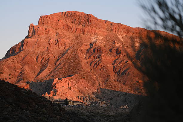 Rugged volcanic landscape and distant village