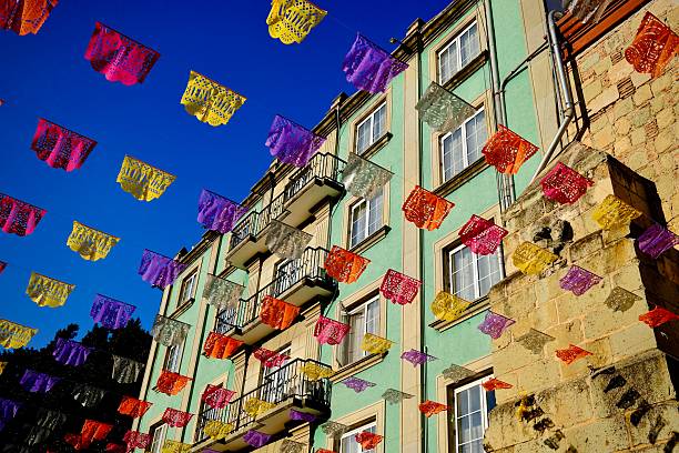 Festive Papel Picado Over Green Building (Oaxaca de Juarez, Mexico)