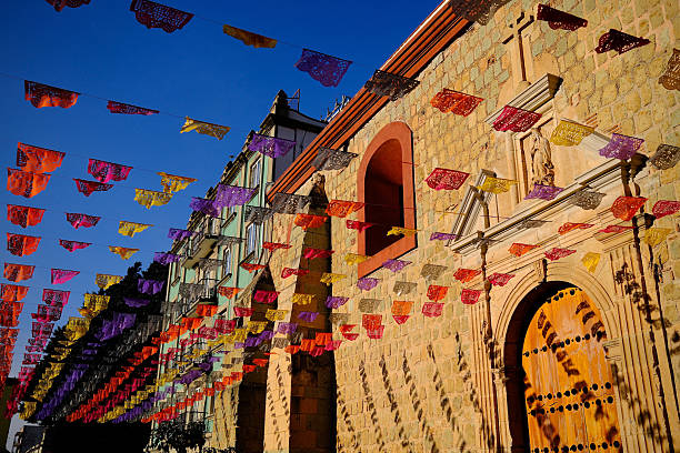 istock Papel Picado Against Stone Wall With Arched Windows (Oaxaca de Juarez, Mexico) 2247472129