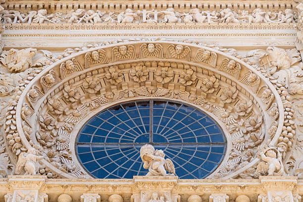 istock Baroque floral carvings and cherubs above round window 2247472666