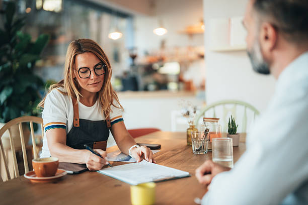 istock Small business owner discussing financing options with loan agent 2247474098