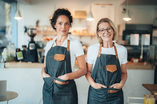 istock Confident coffee shop and bakery owners standing together 2247474105