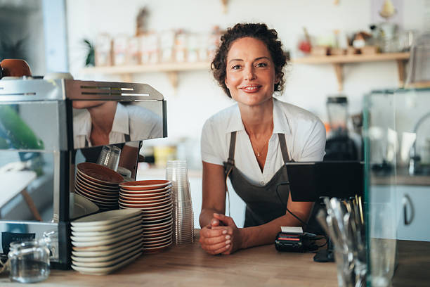 istock Confident barista owner ready to serve with a smile 2247474108