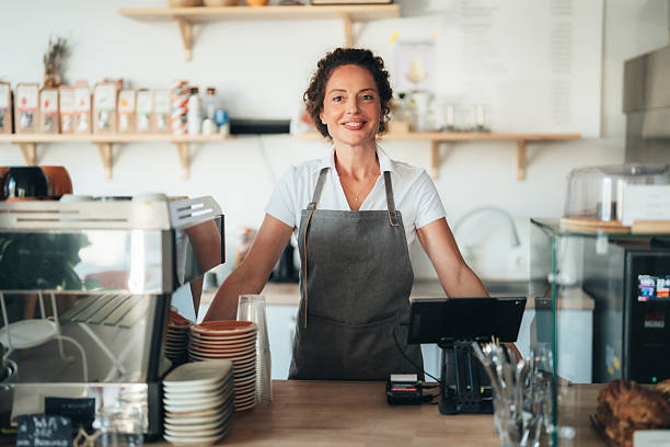 istock Confident barista owner ready to serve with a smile 2247474109