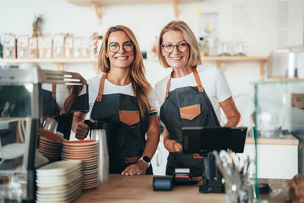 istock Confident coffee shop and bakery owners standing together 2247474112