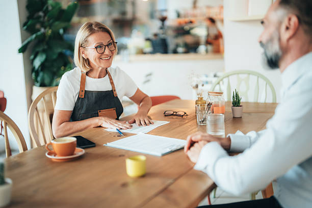 istock Small business owner discussing financing options with loan agent 2247474140