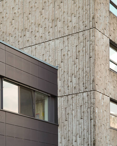 istock Modern architecture meets brutalist concrete facade: contrasting textures and styles 2247474724