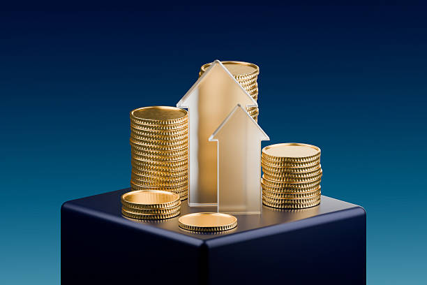 istock Several stacks of gold coins are displayed on a dark blue pedestal 2247475095