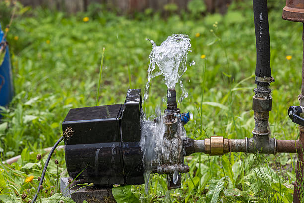 istock Water pump in garden — water flow from outlet 2247475406