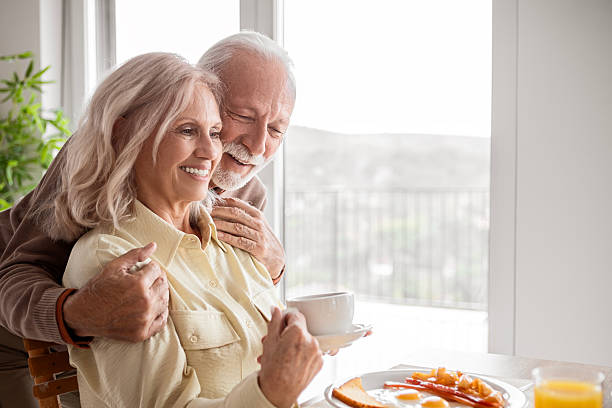 istock Cheerful Older Couple Having Coffee and Conversation 2247477489