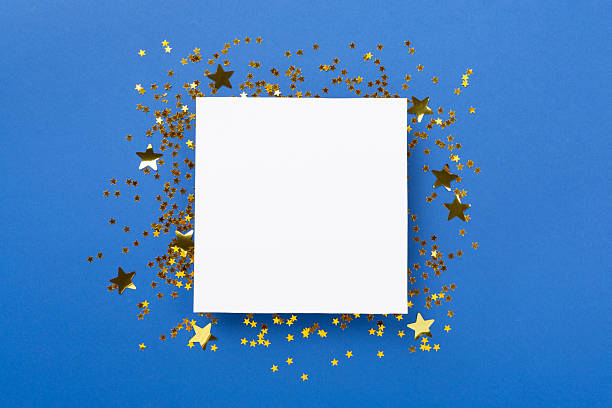 istock Golden star shape confetti on color background, top view 2247477505