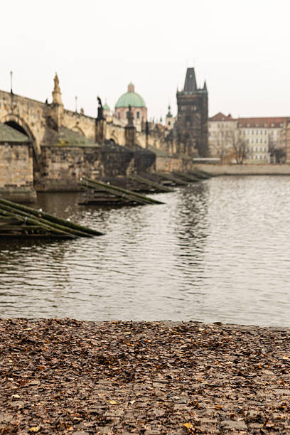 Charles Bridge is a medieval stone arch bridge that crosses the Vltava river in Prague.