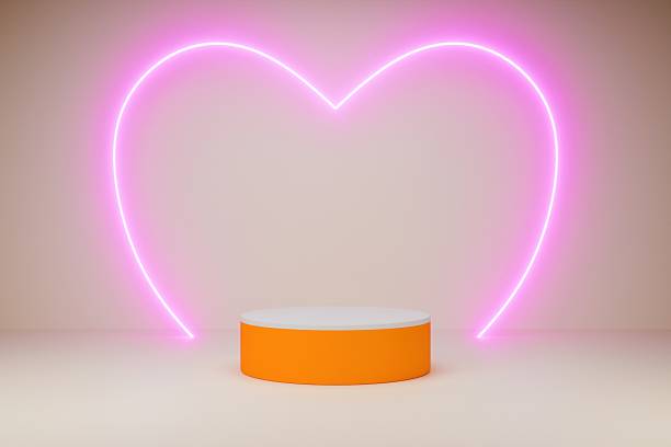 istock A pink podium sits below a glowing neon heart sign 2247481687