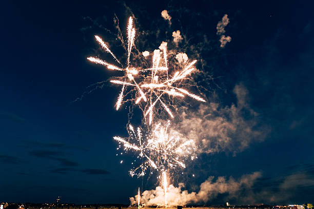 istock Bright Fireworks Rising with Dense Smoke in Evening Sky 2247482944
