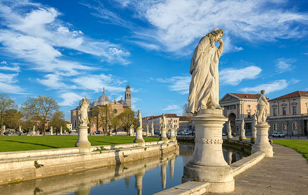 istock Prato della Valle is a large square in Padua, Italy, with a central elliptical island, surrounded by a canal and statues. 2247485193