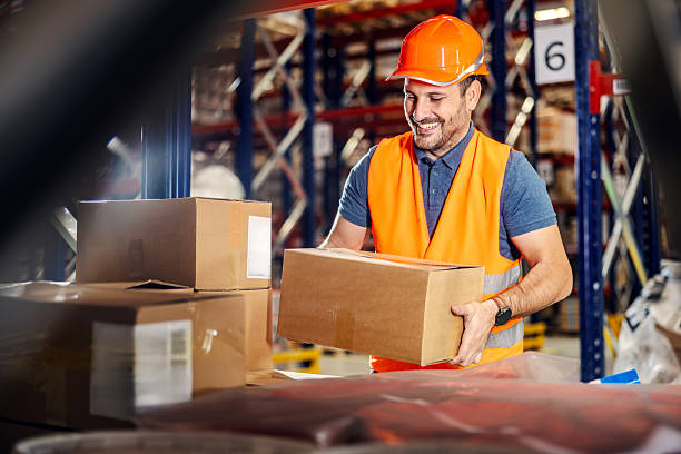 istock Warehouse worker packaging cardboard box for logistics and shipping 2247485450