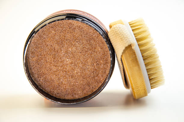 istock Brown sugar scrub in a round container with a natural bristle brush beside it, showcasing beauty and skincare essentials for a refreshing self-care routine 2247488129
