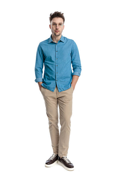 istock Casual man standing with hands in pockets 2247488568