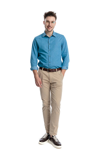 istock Happy casual man standing with hands in pockets 2247488637