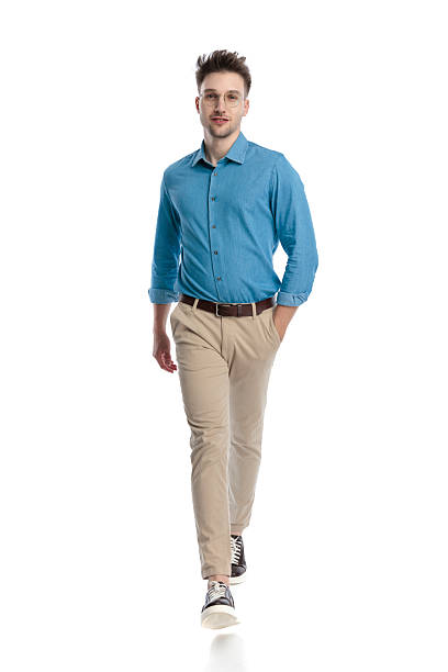 istock Happy casual man walking forward and smiling 2247488670