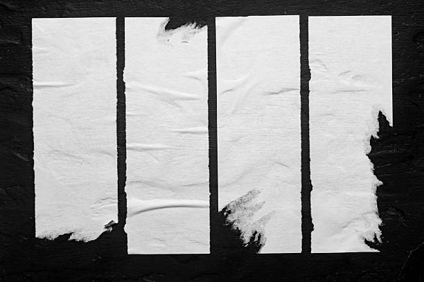 istock old street posters on a black background 2247489091