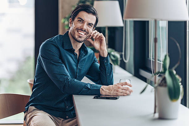 istock Successful businessman sitting by the window 2247489196