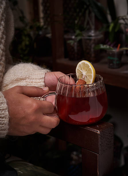 Hand Holding A Cup Of Herbal Tea
