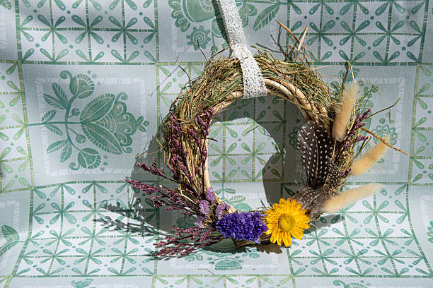 istock Handmade wreath decoration featuring dried flowers and herbs, showcasing skilled craftsmanship and creativity in a charming and inviting setting perfect for home decor 2247492517