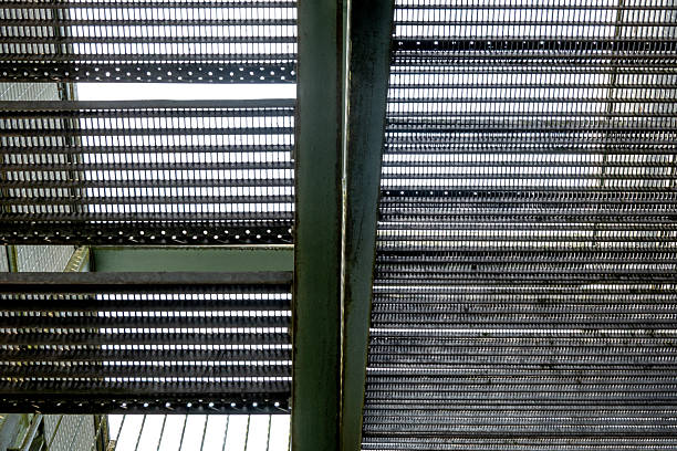 istock Industrial metal stairs leading upwards abstract pattern 2247492555