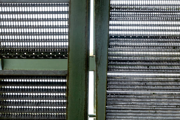 istock Industrial metal stairs leading upwards abstract pattern 2247492636