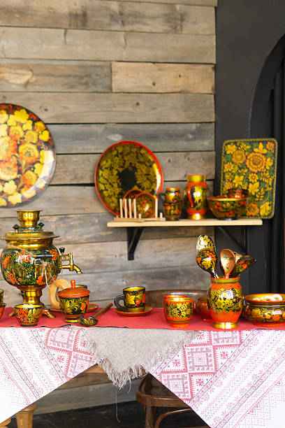 istock A table is set with traditional russian khokhloma painted teaware including a samovar, cups, and spoons. Russian folk art and culture concept for decoration. 2247492780