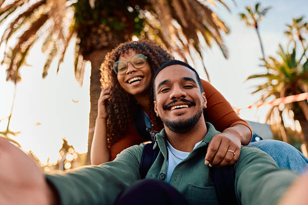 istock Happy multiracial couple taking selfie on vacation feeling joy 2247494383
