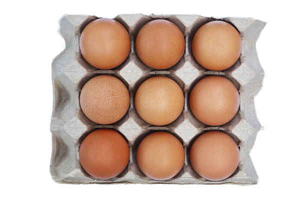 istock nine eggs on recycled paper tray isolated on white. 2247503275