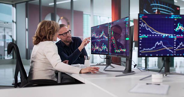 istock Diverse Group Of Brokers Trade Stock Exchange Using Computer Screens 2247505039