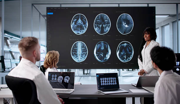 istock Medical Team Examines MRI Scan In Office 2247505143
