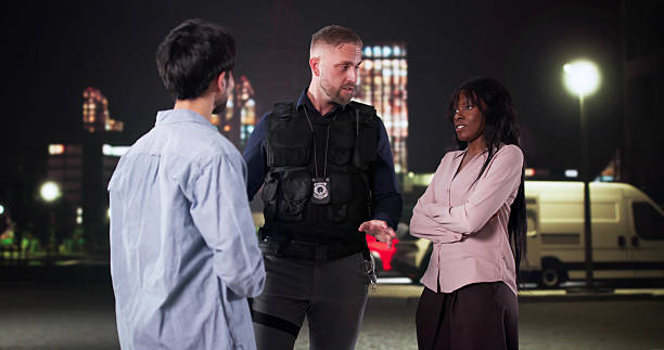 istock Police Officer Mediates Argument Between Diverse Couple 2247505449