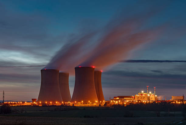 Nuclear power plant in Grohnde with cooling towers and surrounding landscape.