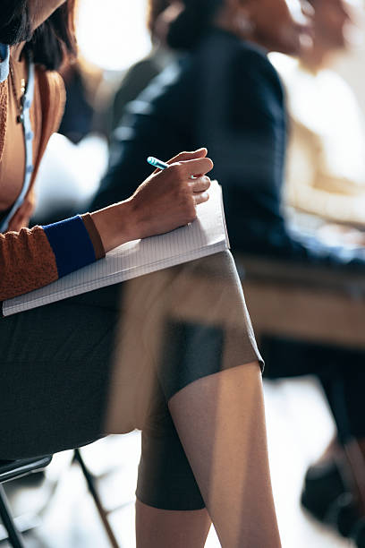 istock Focused Note-Taking At A Business Meeting: Attentive Participant With Pen And Notebook 2247507277