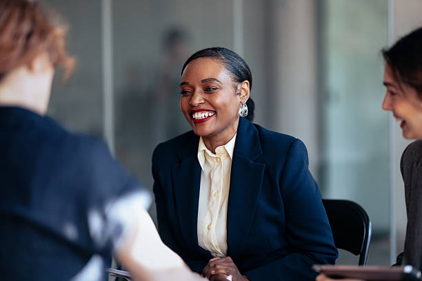 istock Smiling Business Team Engages In Professional Meeting In A Modern Office Setting 2247507300